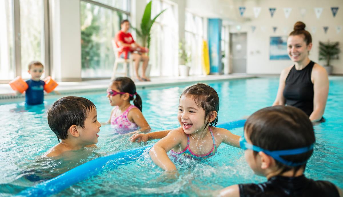 Children enjoying an indoor swimming pool